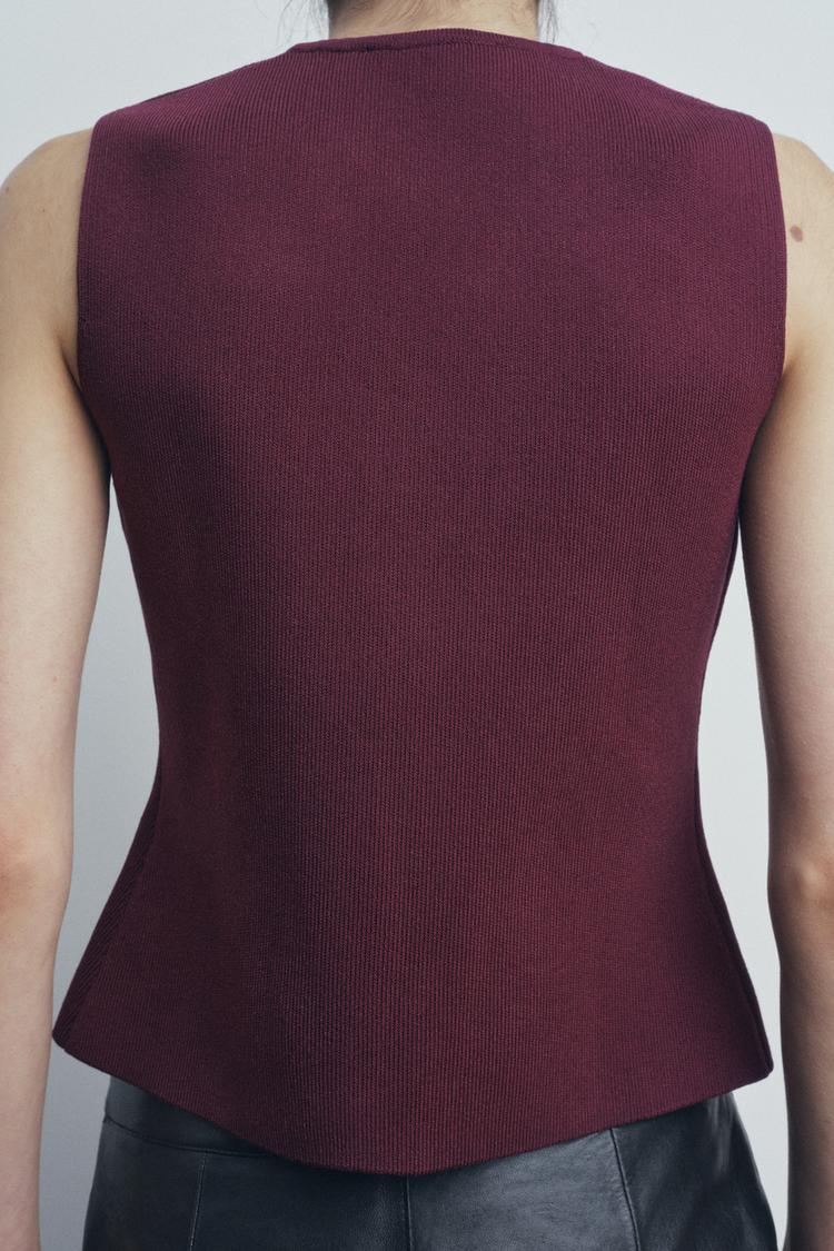 BELLA - Gebreide vest en pluisschede rok